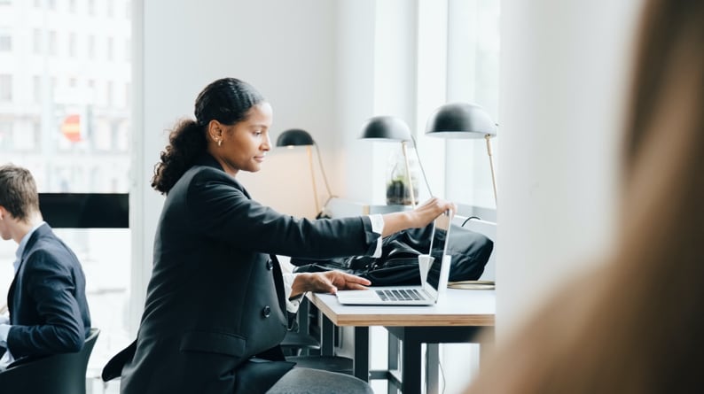 A woman is making an overseas payment with her FX International Payments online account