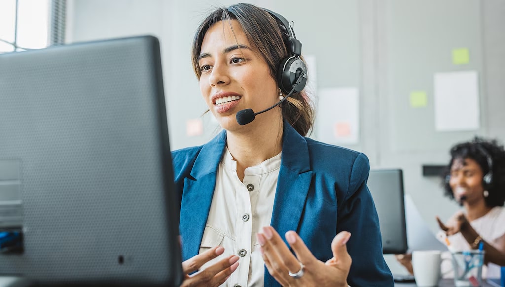 Photo of a woman attending a virtual meeting, discussing managed IT services benefits