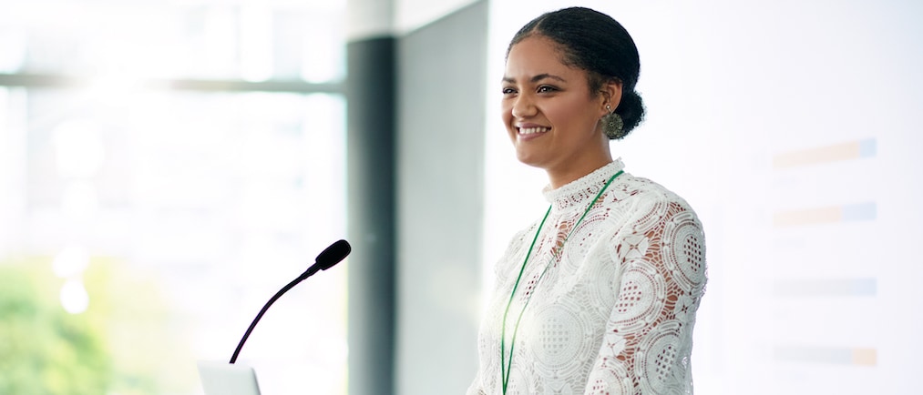 Shot of a young businesswoman delivering a presentation at a conference