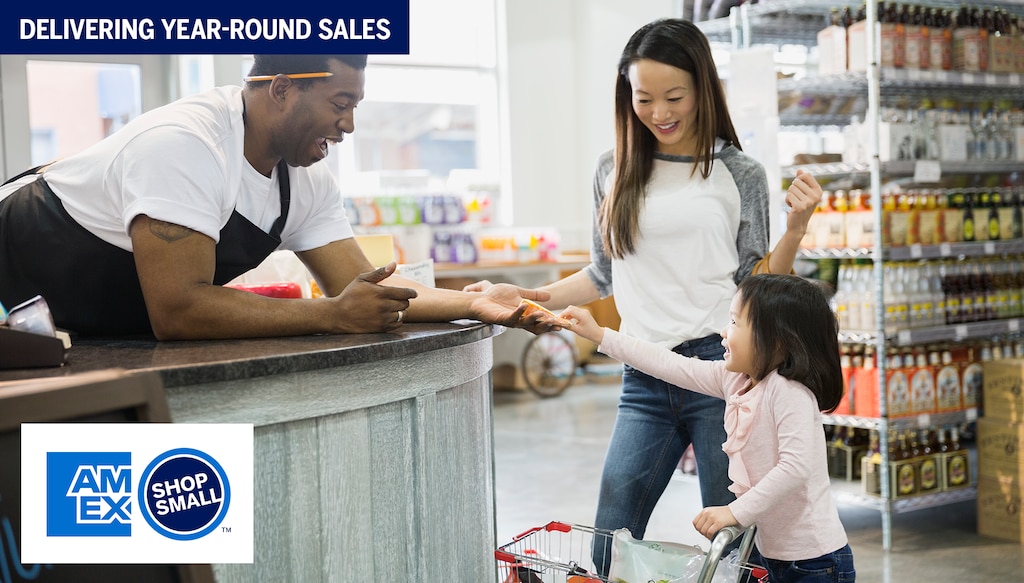 little girl checking out with cashier