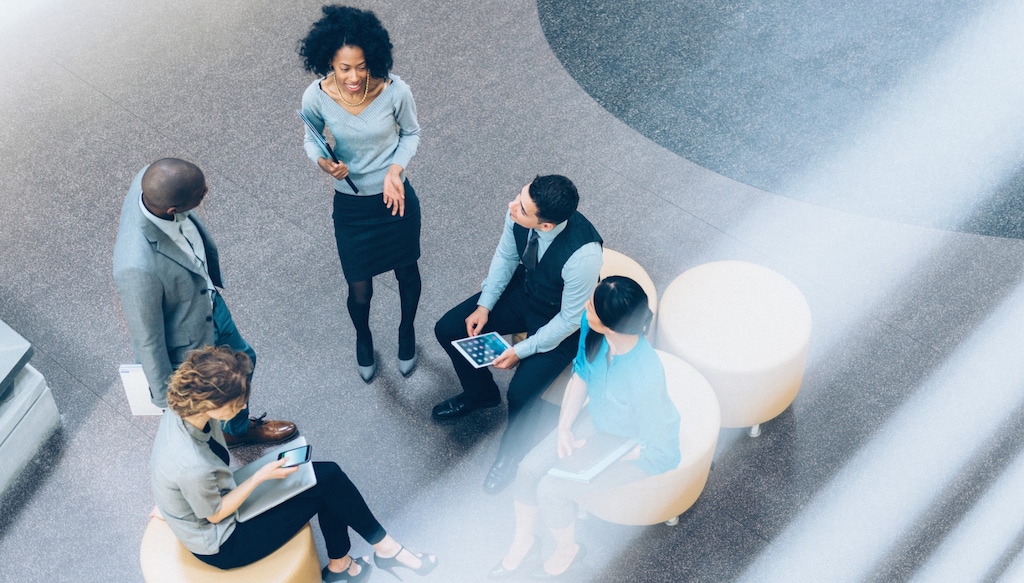 group of employees networking in lobby