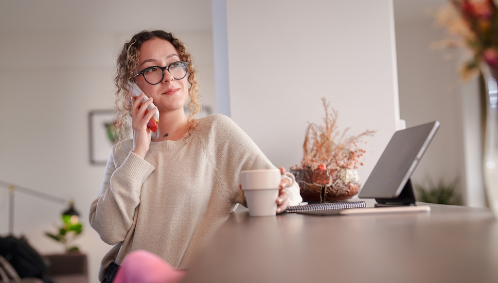 woman working from home taking a phonecall