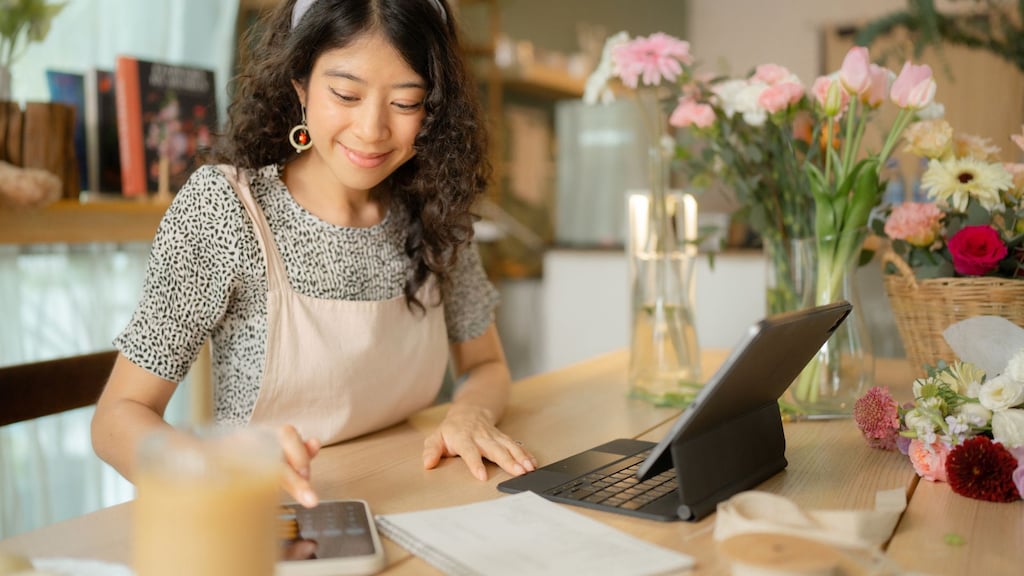 Woman using calculator