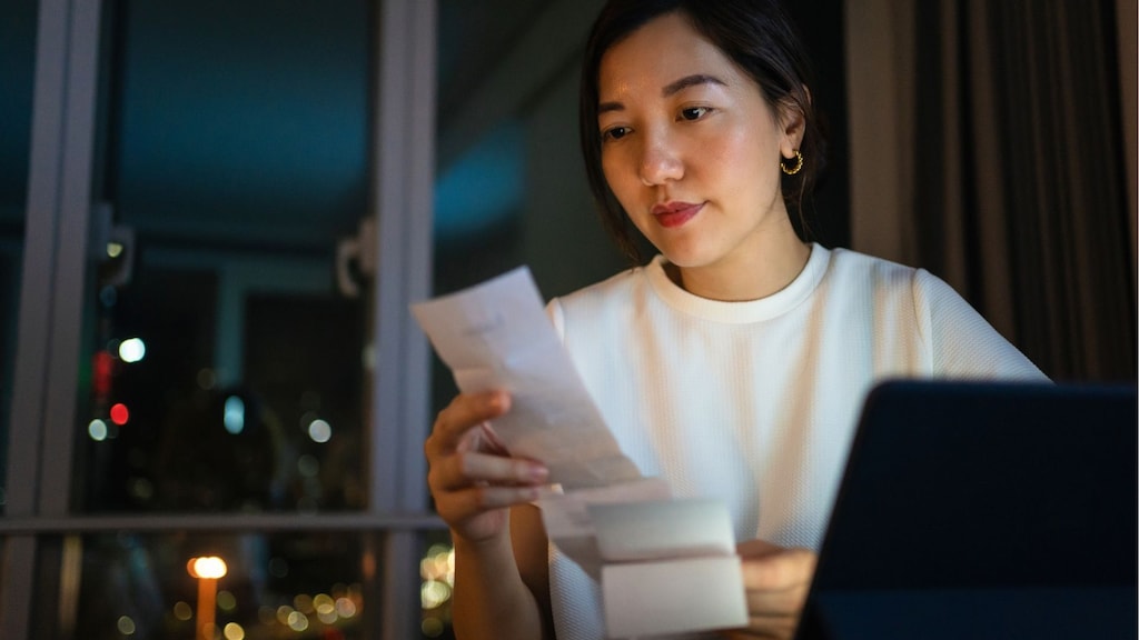 Woman reviewing receipt