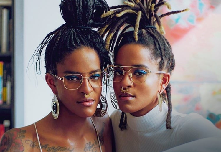Two women posing and wearing their company eyewear