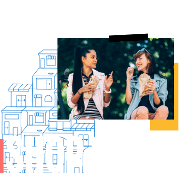 2 people socializing while eating lunch outside